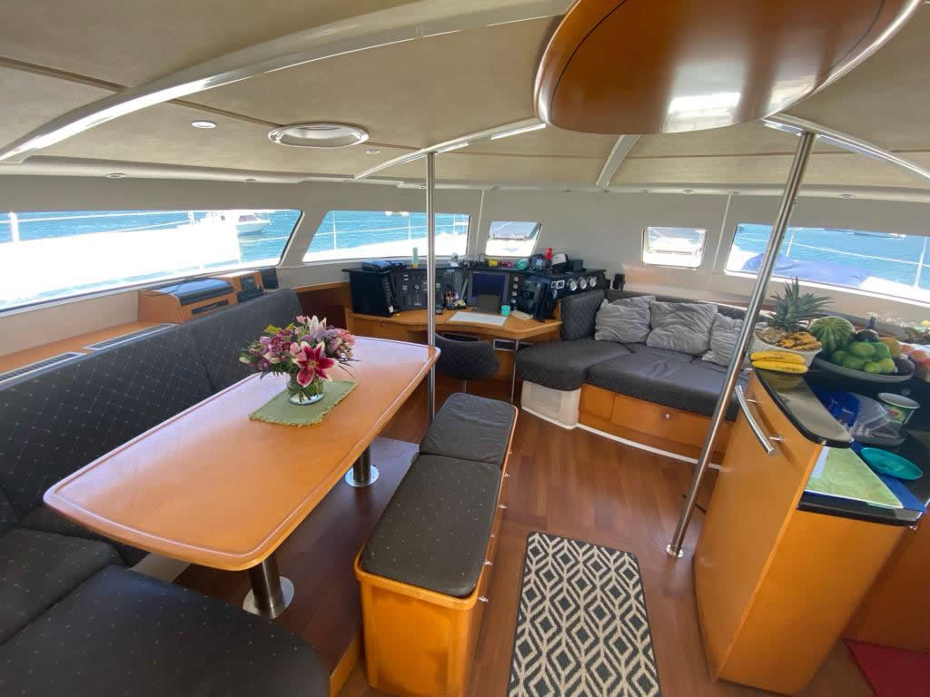 Well-maintained and comfortable full interior of Why Not's main cabin.